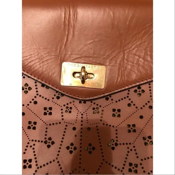 BCBGMaxAzria laser cut trapeze handbag